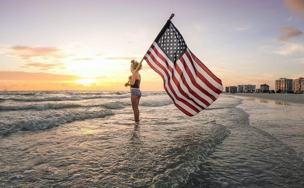 flag-beach-girl – CITIZEN FREE PRESS